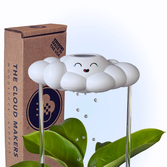 Misty the Cloud next to her packaging on a light blue background.