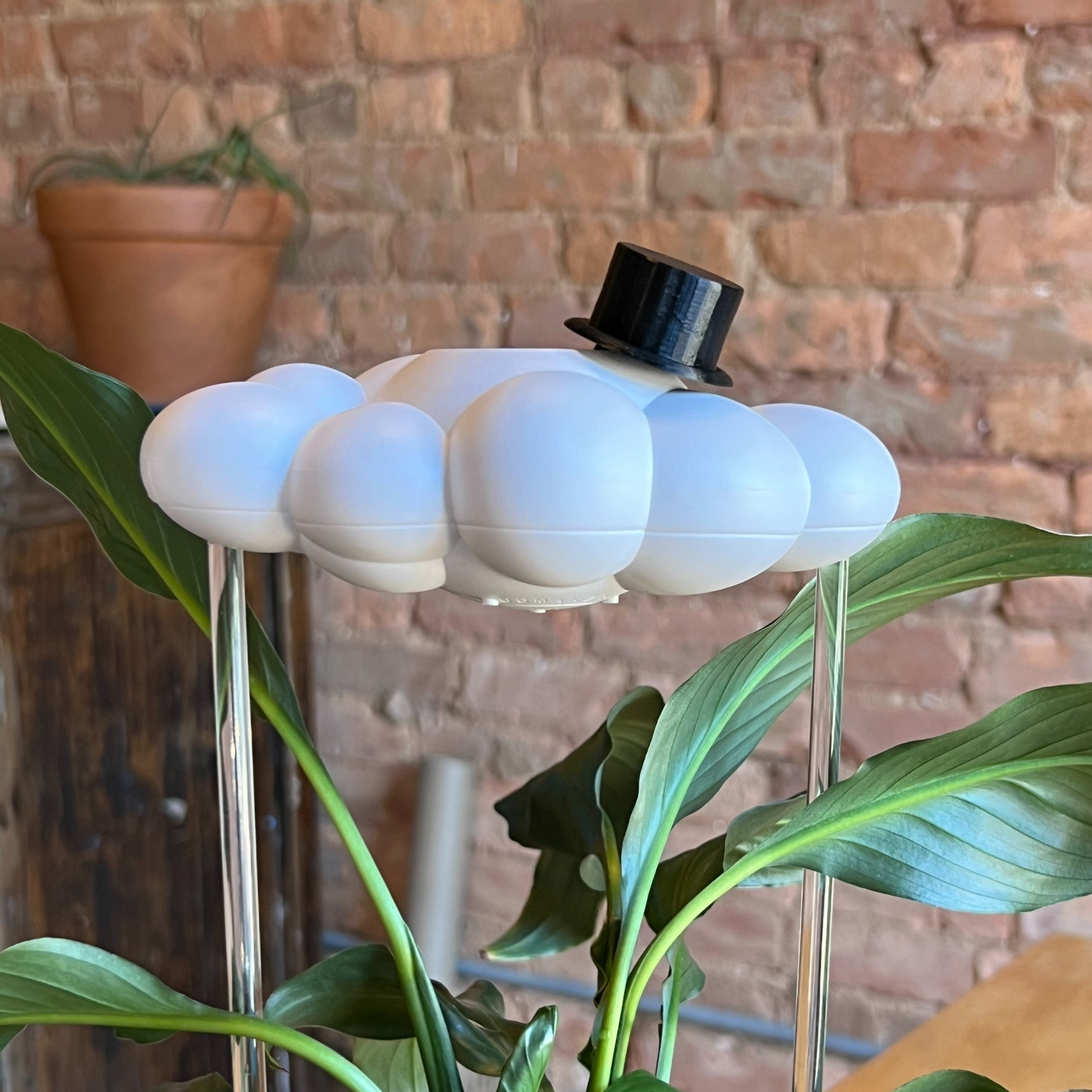 Original dripping rain cloud with top hat charm