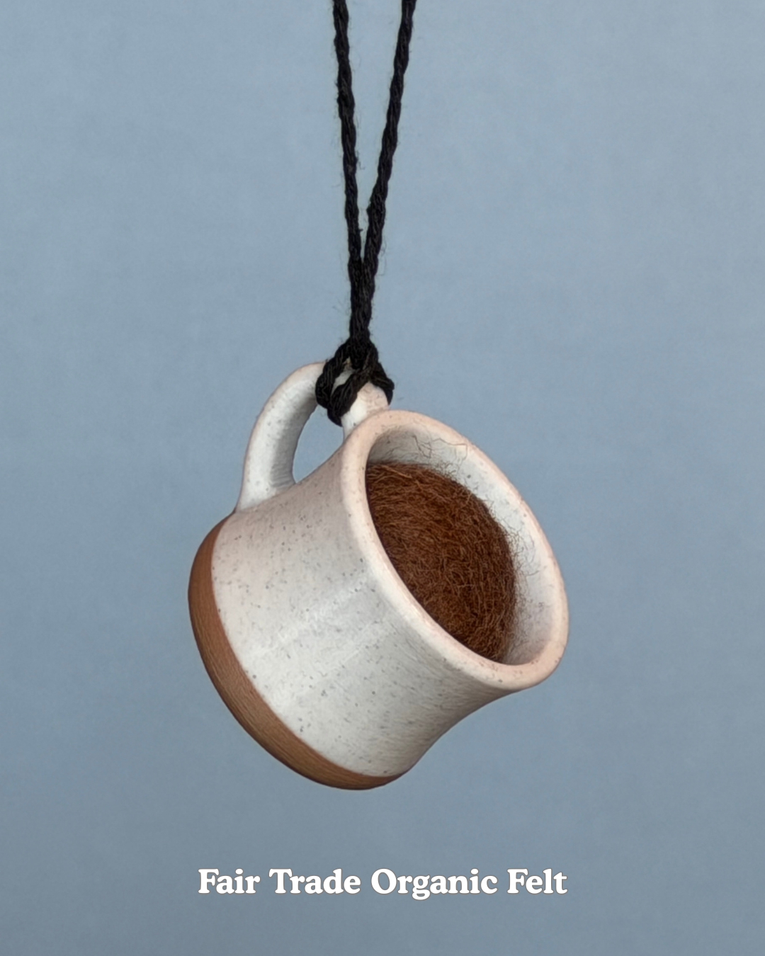 Sky drops brew the day diffuser against a gray background, labeled 'Fair Trade Organic Felt'.