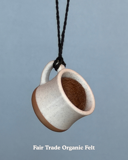 Sky drops brew the day diffuser against a gray background, labeled 'Fair Trade Organic Felt'.
