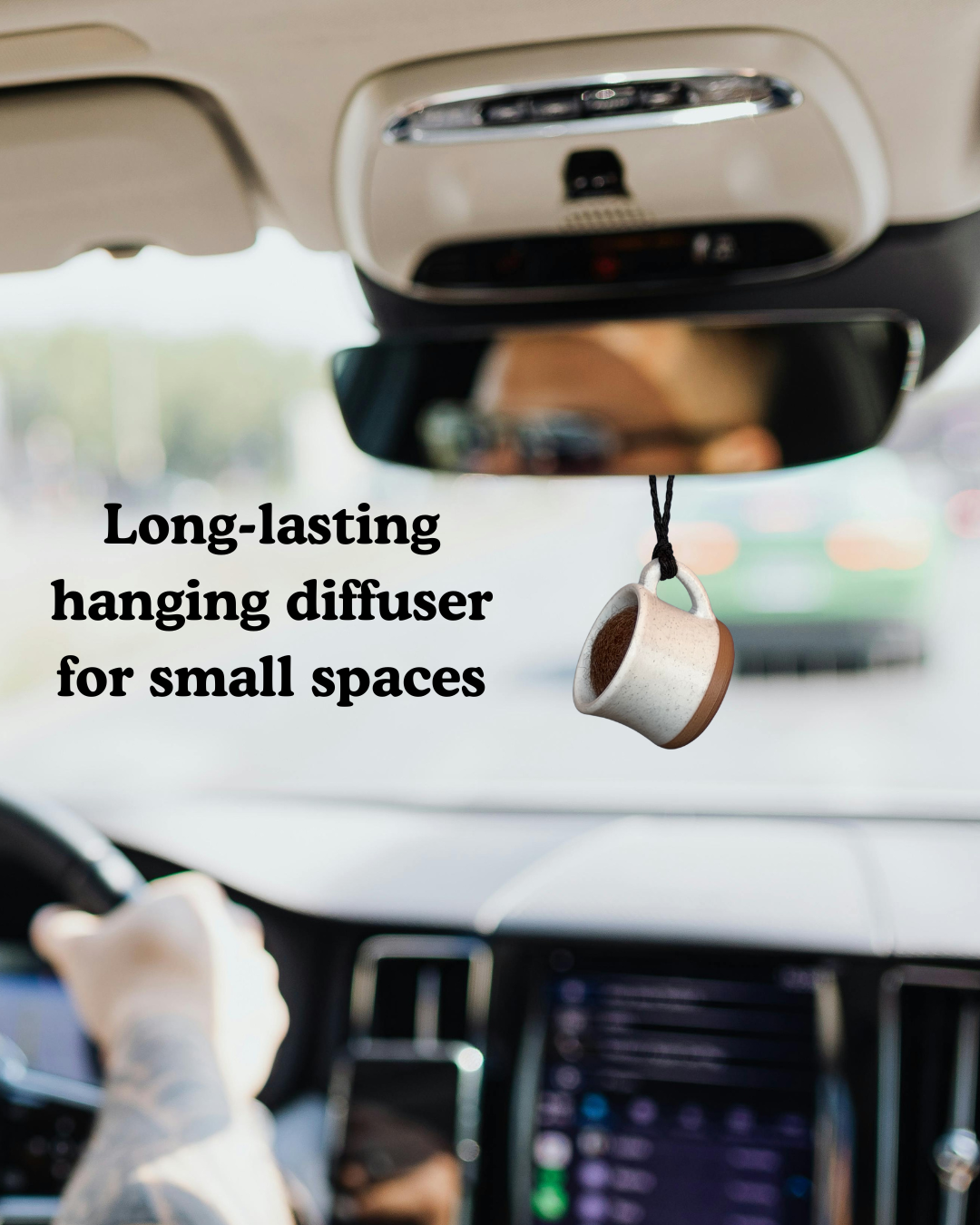 Car diffuser hanging from the rearview mirror with text 'Long-lasting hanging diffuser for small spaces'.