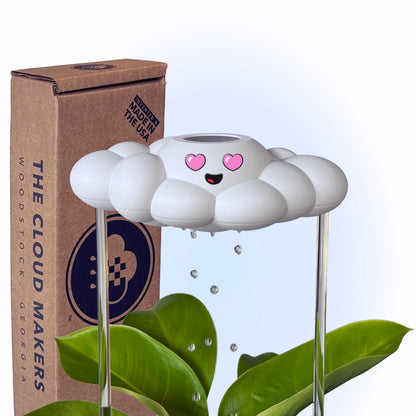 Chloe the Cloud, next to its packaging, on a white background.