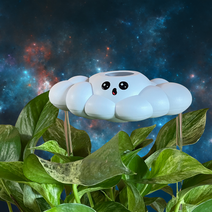 Cosmo the Cloud on top of green leaves against a starry space background