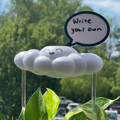 Chelsea the Cloud with a speech bubble in an outdoor setting