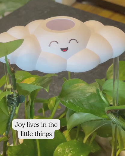 Chelsea the cloud watering a plant